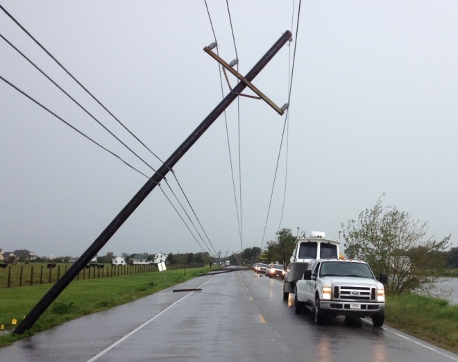 Escorted by harbor police after Hurricane Isaac, the Coast Survey navigation response team had to skirt downed utility poles and hanging wires on closed Hwy 1, as they made their way from Lafayette to Port Fourchon.