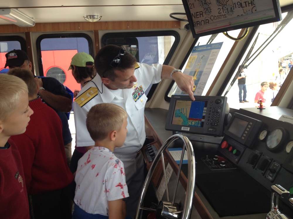 Rear Adm. Gerd Glang explains charts to kids