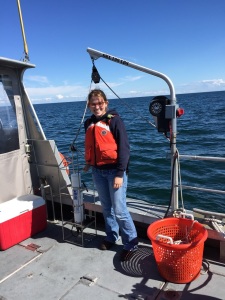 Valerie taking a CTD (Conductivity, Temperature, and Depth) cast to measure sound speed in the water.